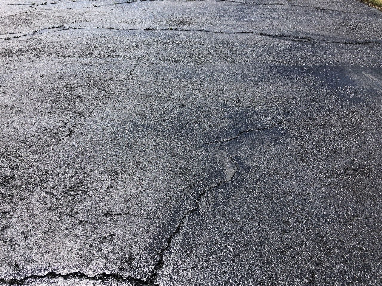 How Often Should You Sealcoat a Driveway in NJ? (2026 Schedule) - New Jersey asphalt damage and repair solutions